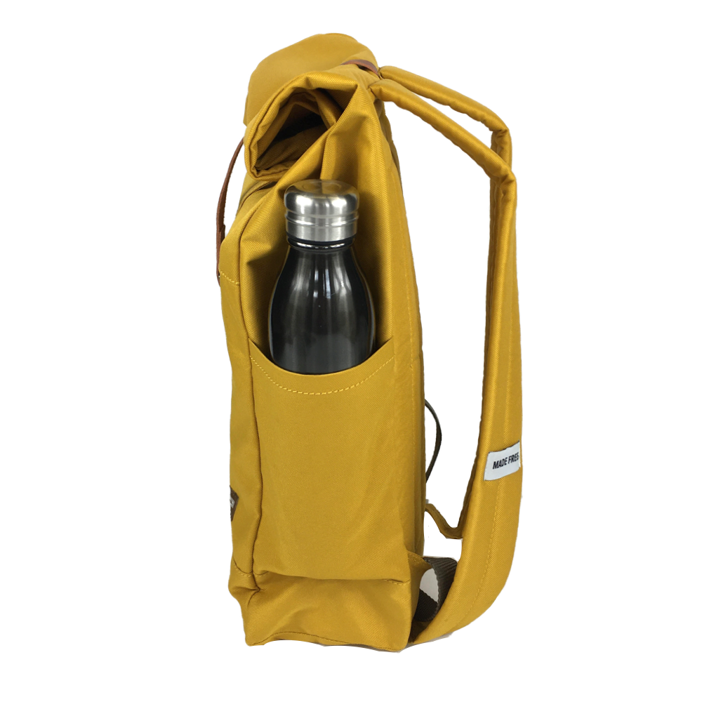 lightweight roll top backpack. best roll top backpack waterproof. canvas roll top bag. best roll top backpack. rolling backpacks. eco friendly roll top backpack. 100recycled backpack. socially responsible backpacks. backpacks made from recycled materials. sustainable travel bag. mustard.