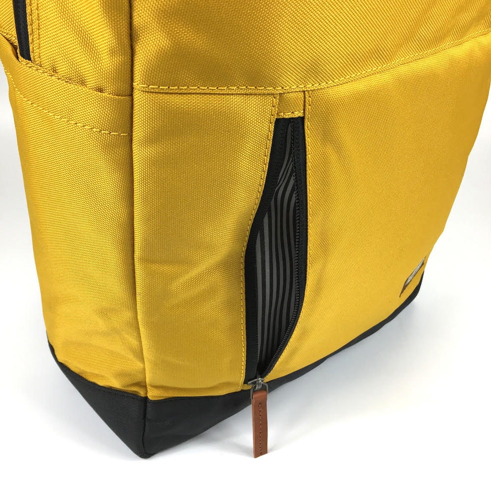 vintage canvas backpack. waterproof canvas backpack. canvas laptop backpack. large canvas backpack. 100recycled backpack. socially responsible backpacks. backpacks made from recycled materials. sustainable travel bag. book bags for college. backpacks for school. musturd.